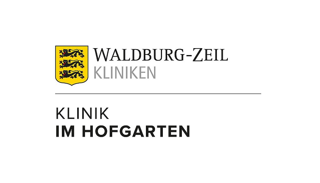Farbiges Logo der Waldburg-Zeil Kliniken – Klinik im Hofgarten mit gelbem Wappen und schwarzem Schriftzug.